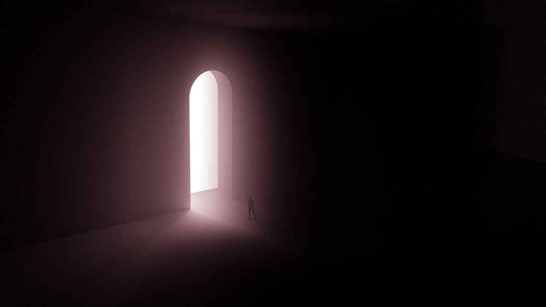 human walking into tall light portal