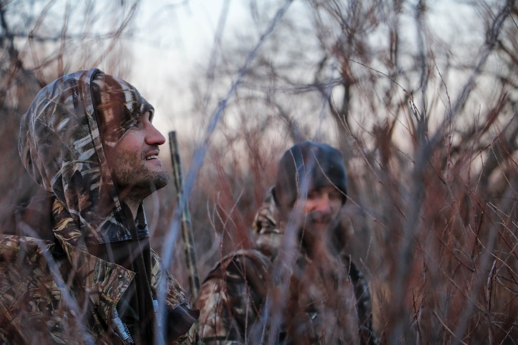 Picture of two men duck hunting with shotguns
