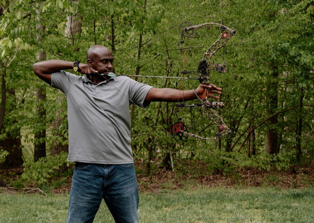 Picture of a man shooting a compound bow