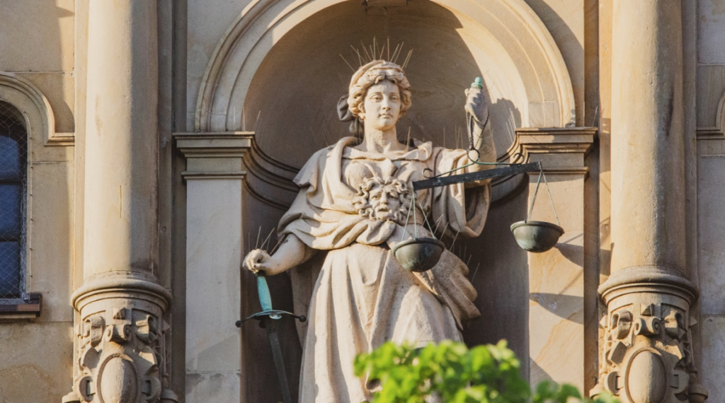Lady Justice and her scales in one hand, a sword in the other